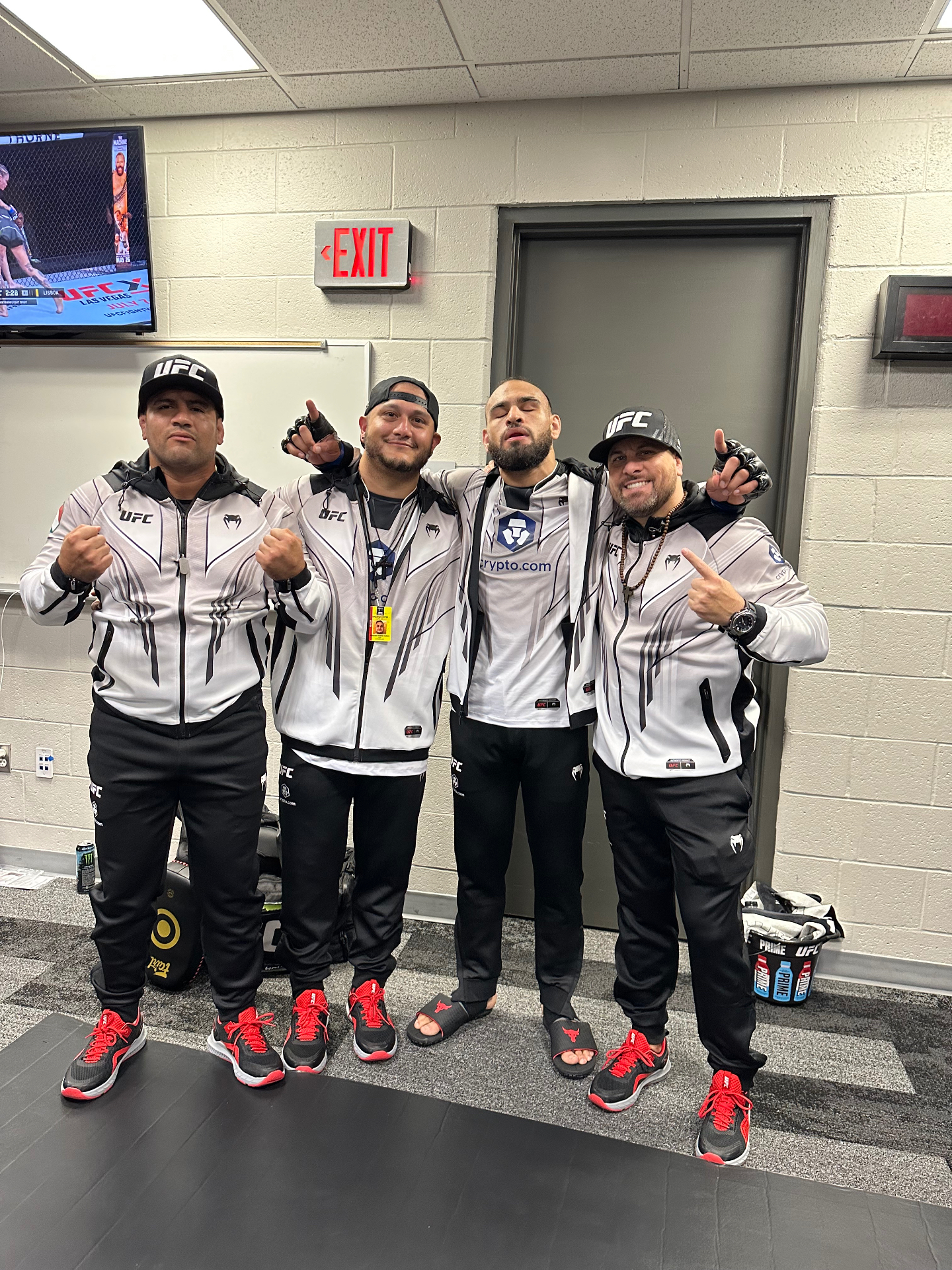 Tracy Hess and the Subfighter corner team with Gabe Green in the UFC locker room