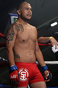 Fernando Vargas ringside in red Subfighter fight shorts